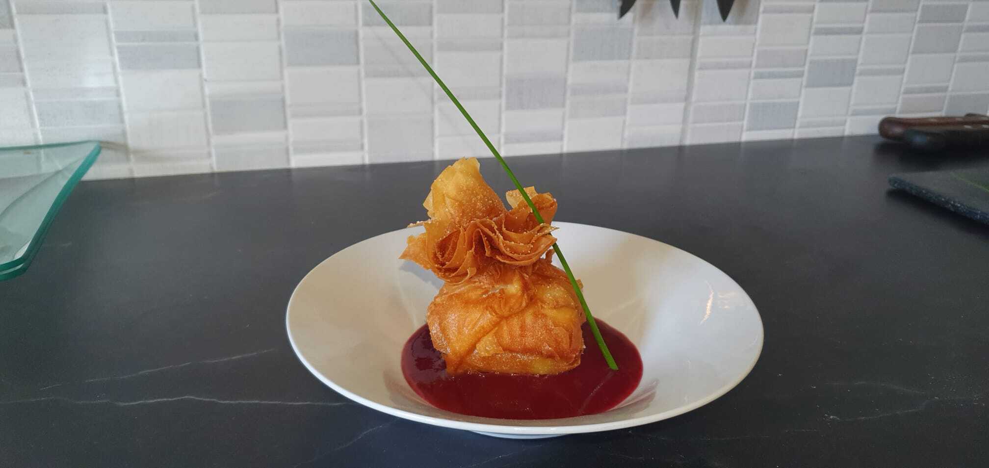 deep fried smoked cheese parcel with raspberry coulis